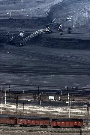Kazakhstan coal industry - Train transporting coal out of an Ekibastuz open pit coal mine photo