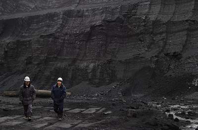 Kazakhstan coal industry - Ekibastuz open pit coal mine workers photo